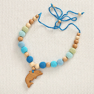 Фото товара "Слингобусы Дельфин, деревянно-вязаная игрушка" из магазина ЛиноБамбино