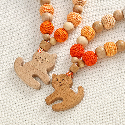 Фото товара "Слингобусы Котенок, деревянно-вязаная игрушка" из магазина ЛиноБамбино