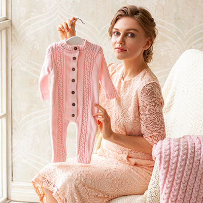 Вязаный комбинезон "Косички" розовый